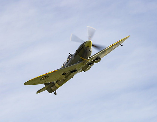White and Yellow Jet Plane in Mid Air