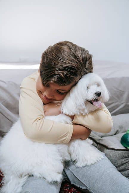 A Boy Hugging His Pet Dog