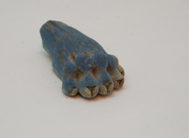 a small blue and white object with a small piece of wood - File:Lions Paw in Lapis Lazuli (469753218
